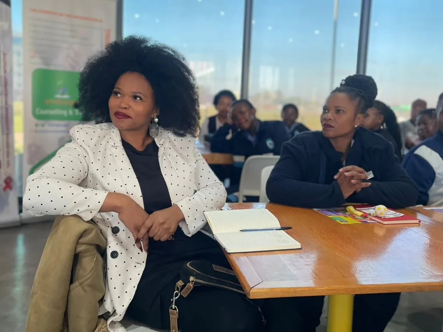 Women discussing HIV prevention options at a community dialogue