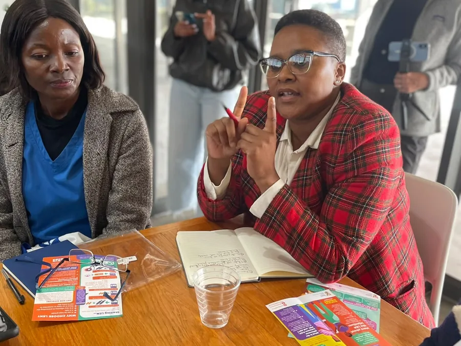 Community members reviewing HIV prevention information