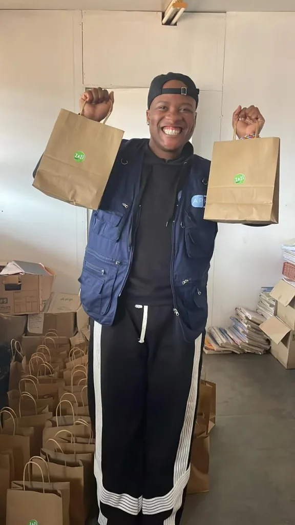 Jordan with ZAZI outreach packs before a school visit